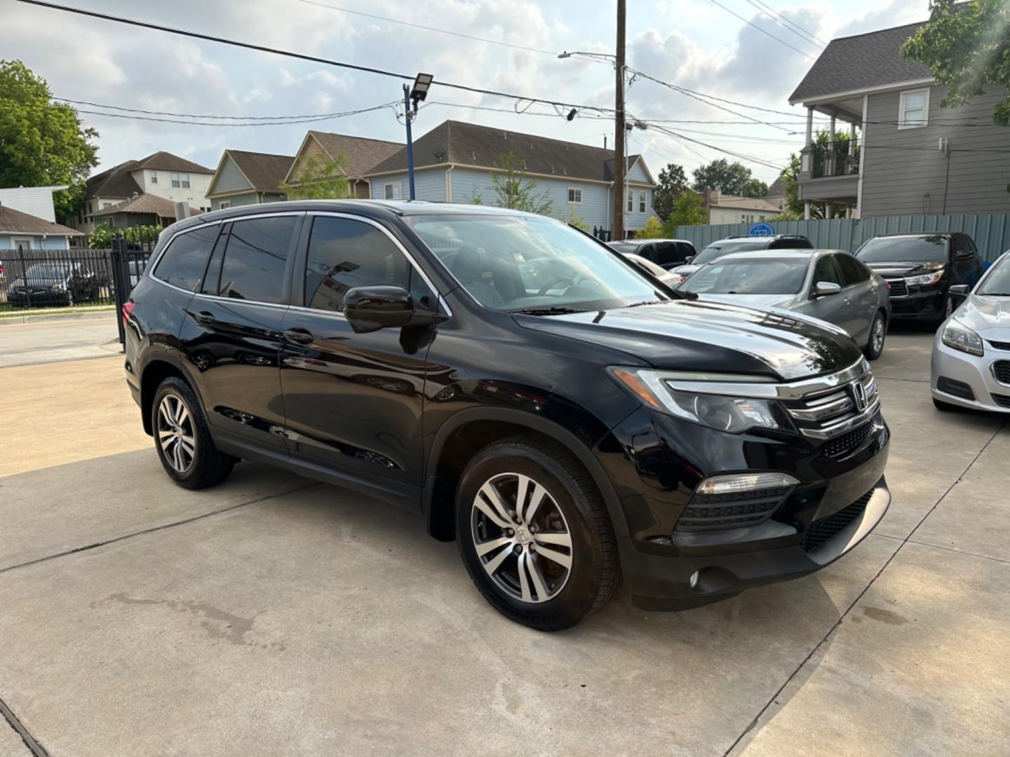 2016 Black /Silver Honda Pilot EX-L (5FNYF5H57GB) with an 3.5L engine, Automatic transmission, located at 1501 West 15th St., Houston, 77008, (713) 869-2925, 29.797941, -95.411789 - Photo#1